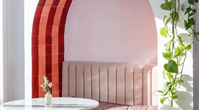 Terrace with tiled arch featuring red and pink zellige 